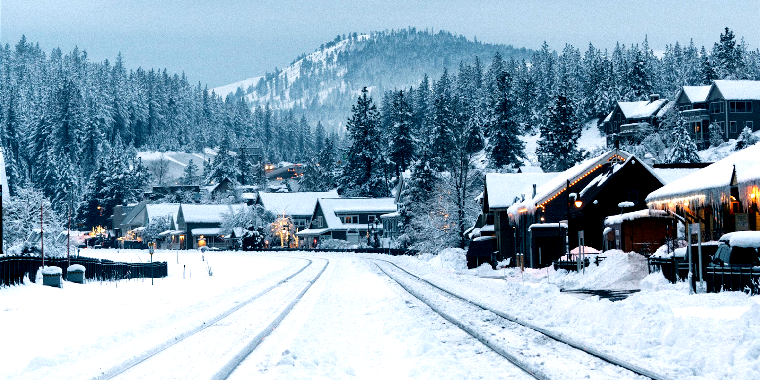 snowy resort town with train tracks