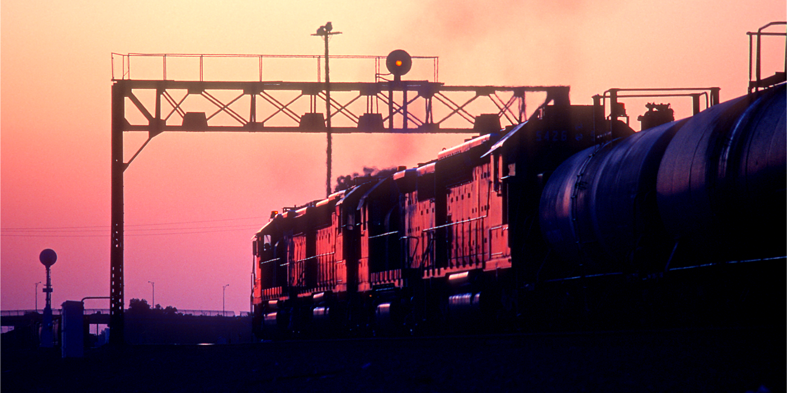 cargo train in rail yard at dusk